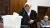 An Afghan parliamentarian casts her ballot in an election in Kabul in 2010. (file photo) 