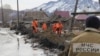 Emergency Situations Ministry personnel erect flood barriers in Altai Krai on March 24.