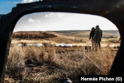 Ukrainian volunteers collect the remains of Ukrainian and Russian soldiers in Kharkiv last month,