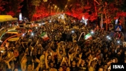 Iranians pour into the streets of Tehran to celebrate the historic nuclear deal agreed with world powers in Vienna in July 2015.