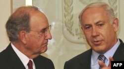 Israeli Prime Minister Binyamin Netanyahu (right) meets with U.S. envoy George Mitchell in Jerusalem.