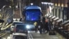 U.S. diplomats and their families who were expelled from Russia prepare to board a bus to leave the embassy compound in Moscow on April 5.