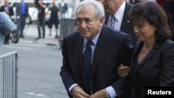 Dominique Strauss-Kahn and his wife, Anne Sinclair, arrive for a hearing at the New York State Criminal Courthouse in New York today.