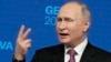 Russian President Vladimir Putin gestures as he speaks during a news conference after his meeting with U.S President Joe Biden in Geneva on June 16. 