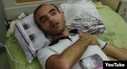 Rasim Aliyev talked to reporters on August 8 in the hospital after his beating.