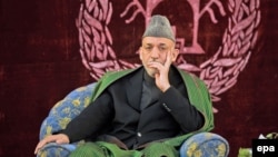 Afghan President Hamid Karzai at a meeting with elders in Konduz (file photo)