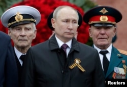 Vladimir Putin takes part in a Victory Day commemoration ceremony in Moscow on May 9.