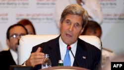 U.S. Secretary of State John Kerry addresses the Friends of Syria" meeting in the Qatari capital, Doha, on June 22.