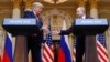 U.S. President Donald Trump (left) and Russian President Vladimir Putin shake hands during a joint news conference after their meeting in Helsinki on July 16.