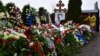 A mourner lays flowers on the grave of Russian opposition leader Aleksei Navalny at the Borisovskoye cemetery in Moscow on March 2, the day after Navalny's funeral.