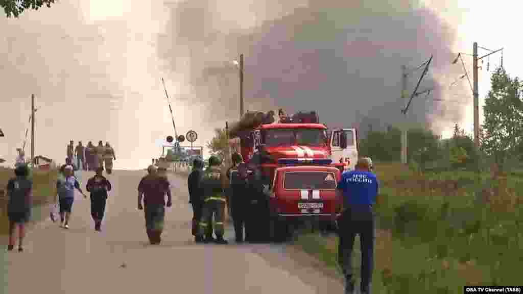 Russian Emergency Situations Ministry employees evacuate residents from the nearby village of Kamenka.