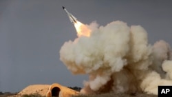 The image shows an S-200 missile fired during a military drill in Iran