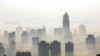 China -- An aerial view of buildings standing out amid haze engulfing Wuhan, central China's Hubei province, 03Dec2009