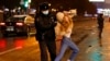 Riot police detain a young woman during a protest against the jailing of opposition leader Aleksei Navalny in Pushkin Square in Moscow on January 23.