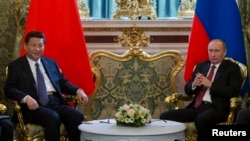 The new Chinese leader Xi Jinping chose Russia as his first foreign trip in March 2013, where he met President Vladimir Putin at the Kremlin.