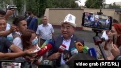 Ex-President Askar Akaev talks to reporters after returning to Kyrgyzstan in August.