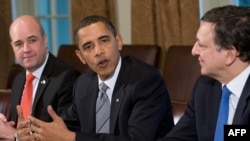 U.S. President Barack Obama (center) speaks, surrounded by Swedish Prime Minister Fredrik Reinfeldt (left) and European Commission President Jose Manuel Barroso.