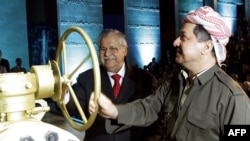 Iraqi President Jalal Talabani (left), a Kurd, and Kurdish regional President Mas'ud Barzani open a ceremonial valve during an event to celebrate the start of oil export from Kurdistan in June.