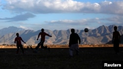 Youths play football in Kabul. (file photo)