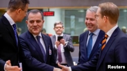 (Left to right) Foreign ministers Peter Szijjarto of Hungary, Jeyhun Bayramov of Azerbaijan, Pekka Haavisto of Finland, and Tobias Billstrom of Sweden attend an EU meeting with the Eastern Partnership countries in Brussels on December 12.