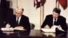 U.S. President Ronald Reagan (right) and Soviet President Mikhail Gorbachev sign the Intermediate-Range Nuclear Forces (INF) treaty at the White House on December 8, 1987.