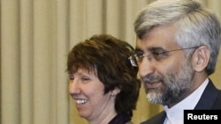 EU foreign policy chief Catherine Ashton with Said Jalili, Iran's longtime chief nuclear negotiator and recently appointed foreign minister, at the UN in Geneva in early December