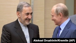 Russian President Vladimir Putin with Ali Akbar Velayati (left), a senior adviser to Iranian Supreme Leader Ayatollah Ali Khamenei.