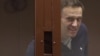 Aleksei Navalny inside a glass cell during a court hearing in Moscow on February 12. "We have to all understand that [he] is now not just a political figure for us but a political prisoner who was illegally tried and imprisoned," says Aleksei Shitov, head of Yabloko's youth wing in Novosibirsk.