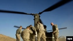 U.S. soldiers receive an ammunition delivery in Khost. Some 30,000 additional U.S. troops are headed to Afghanistan.