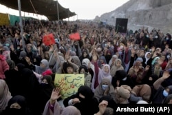 Members of the Shi'ite Hazara community chant slogans during a protest against the killing of a coal miner in Balochistan by IS-K in 2021.