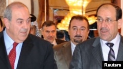 Former Prime Minister Nuri al-Maliki (right) with the head of Al-Iraqiyah, Iyad Allawi