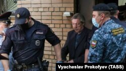 Mikhail Yefremov is escorted after the verdict was announced in Moscow in September 2020.