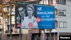 The billboards depict Ursula Von der Leyen alongside Alex Soros, the son of liberal Hungarian-born financier George Soros.