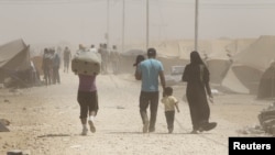 Syrian refugees arrive at the Al Zaatri refugee camp in the Jordanian city of Mafraq late last month. 