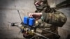 A Ukrainian soldier of the 71st Jaeger Brigade prepares an FPV drone at the front line near Avdyivka, Donetsk region.