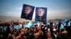 Supporters of Afghan presidential candidate Abdullah Abdullah hold posters of him during an election rally in Parwan Province on March 20.