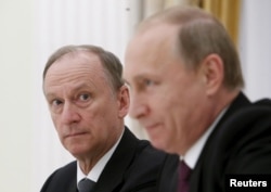 Has Security Council Secretary Nikolai Patrushev (left) "won"?