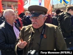 Some 200 people attended the unveiling, many carrying Stalin portraits and Soviet symbols.