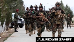 Afghan special forces commandos prepare for a mission against the Taliban in Herat in February 2021.