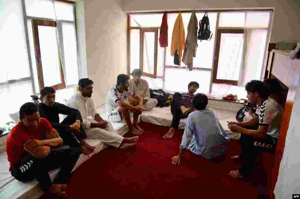 Afghan players relax in their dormitory.