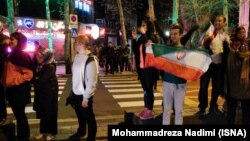 People in Tehran celebrate after news of the agreement reached between Iran and world powers in Lausanne on April 2.