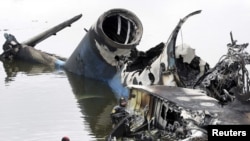 A rescue diver works next to the wreckage of the Yakovlev-42 passenger plane that crashed near the city of Yaroslavl, north of Moscow. 