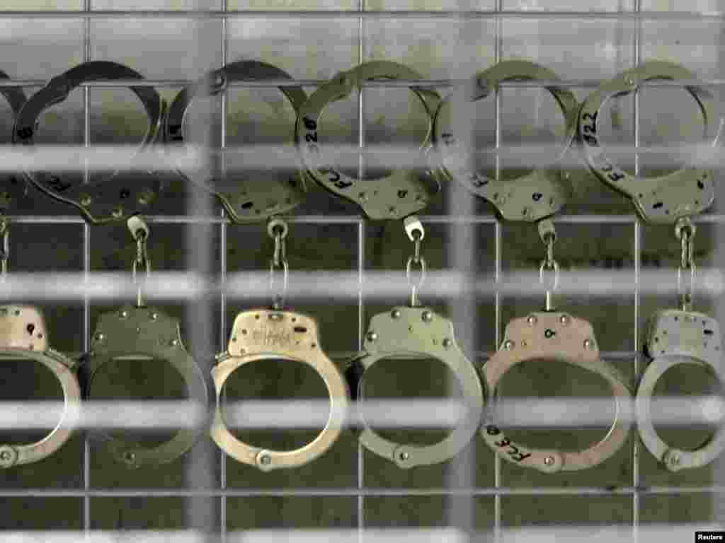 Handcuffs hang in Camp 6, a high-security detention facility at Guantanamo Bay.