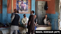 Afghan wrestlers gather at the site of the suicide attack in Kabul on September 6.