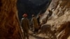 Afghan miners work at a gold mine on a mountainside near the village of Qara Zaghan in Baghlan Province.