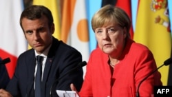 French President Emmanuel Macron (left) and German Chancellor Angela Merkel have come out in support of the Iran nuclear deal. (file photo)