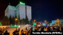 Police spray the crowd of protesters with water on November 8.