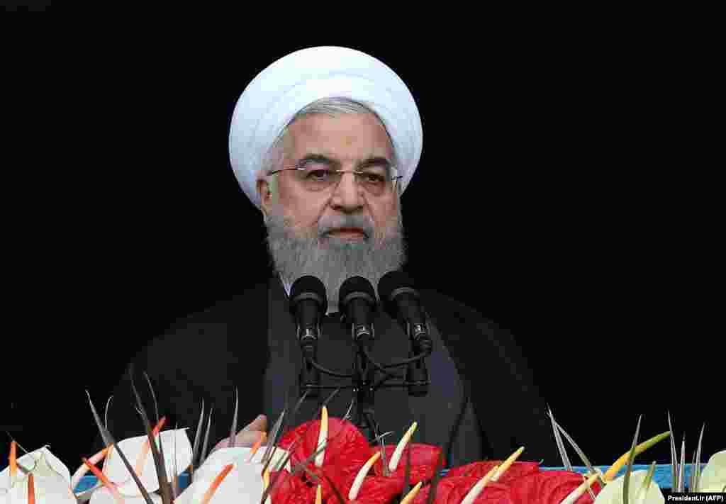 In his address, Rohani said the &quot;enemy will never reach its evil objectives,&quot; vowing that Iran will defeat U.S. sanctions.