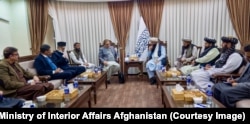 Pakistan's special representative for Afghanistan, Muhammad Sadiq (center left), met the Taliban's interior affairs minister, Sirajuddin Haqqani, in Kabul on December 24.