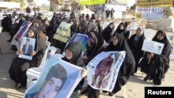 Iranian families protest outside Camp Ashraf in Diyala province, northeast of Baghdad, in December.